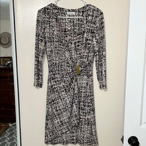 Black white and light pink patterned mock wrap dress